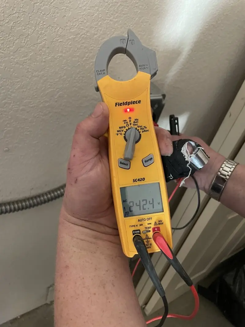 Voltage testing with clamp meter during Electrical Installation Services in Panama City